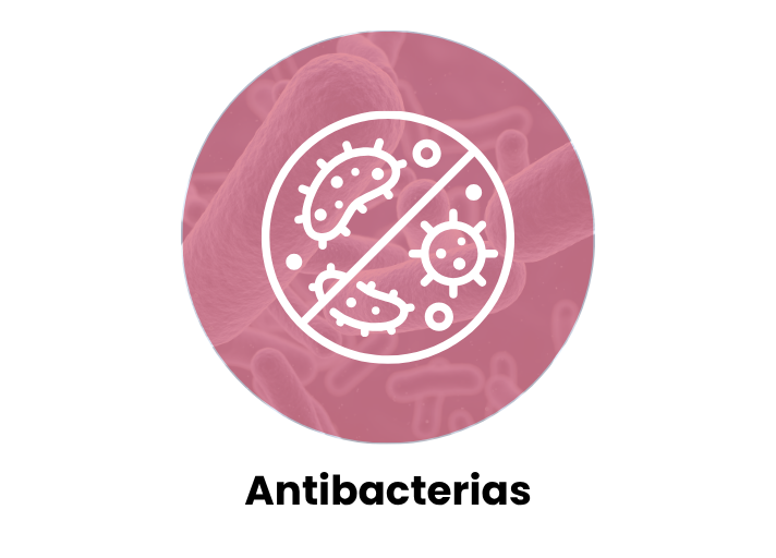 Icono de bacterias tachadas sobre fondo rosa, representa colchón con tratamiento higiénico